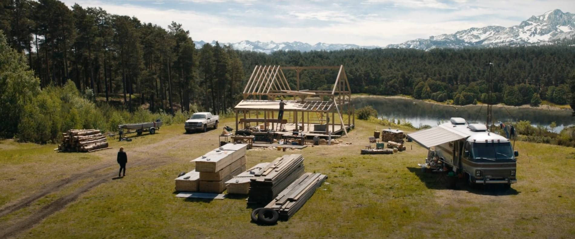 Wide shot of scene at Bourne Wood, with Chris Pratt building a cabin, in Jurassic World: Fallen Kingdom