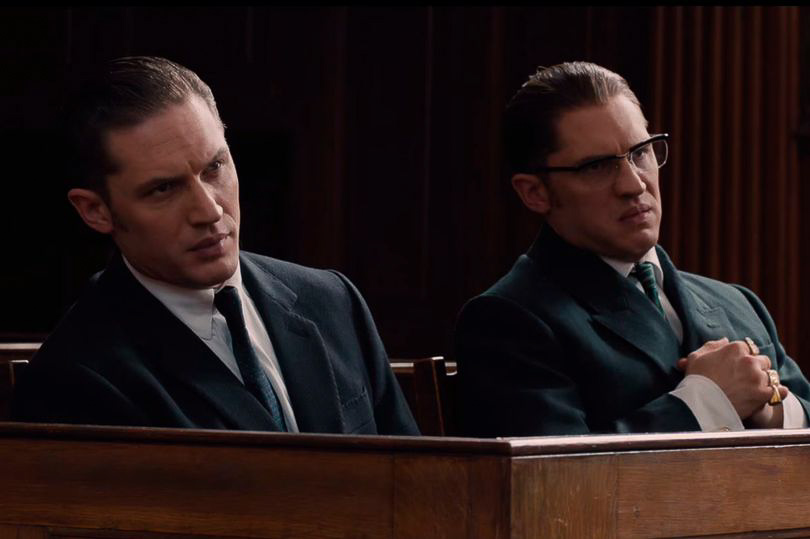 Tom Hardy as Ronnie and Reggie Kray, sat in the dock during a court scene