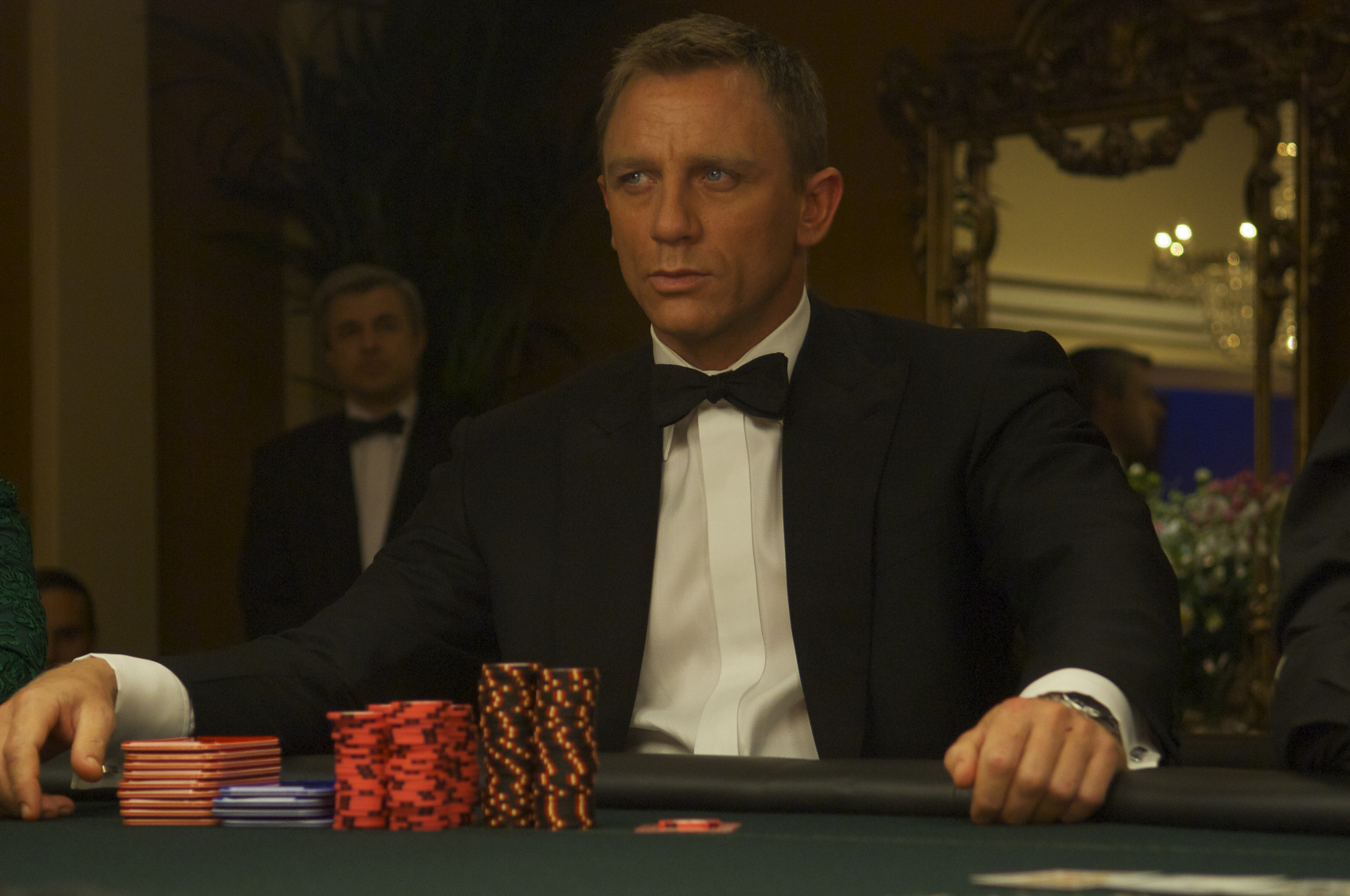 Daniel Craig as James Bond, sat at the casino table