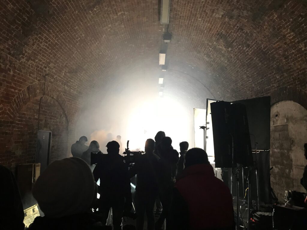 Image of film crew filming a hazy scene within Reigate tunnel