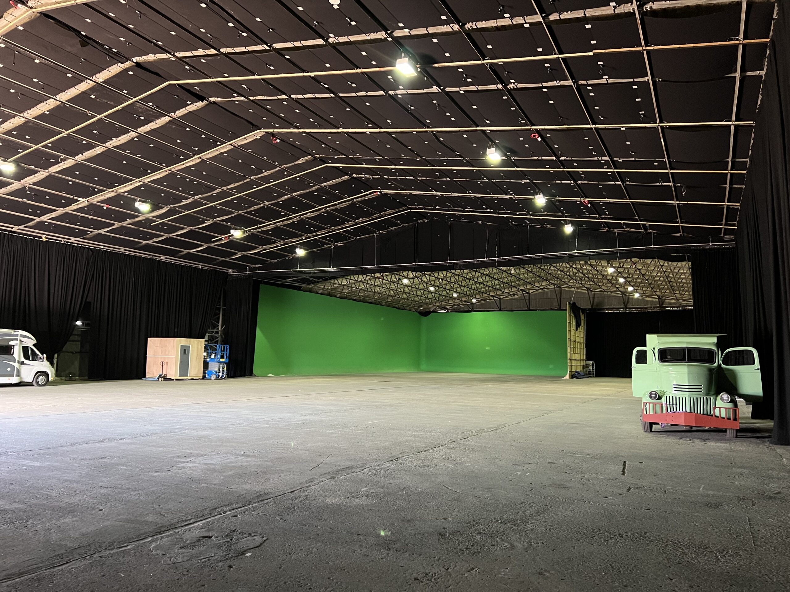 Large interior studio space with green screen at Black Hangar Studios